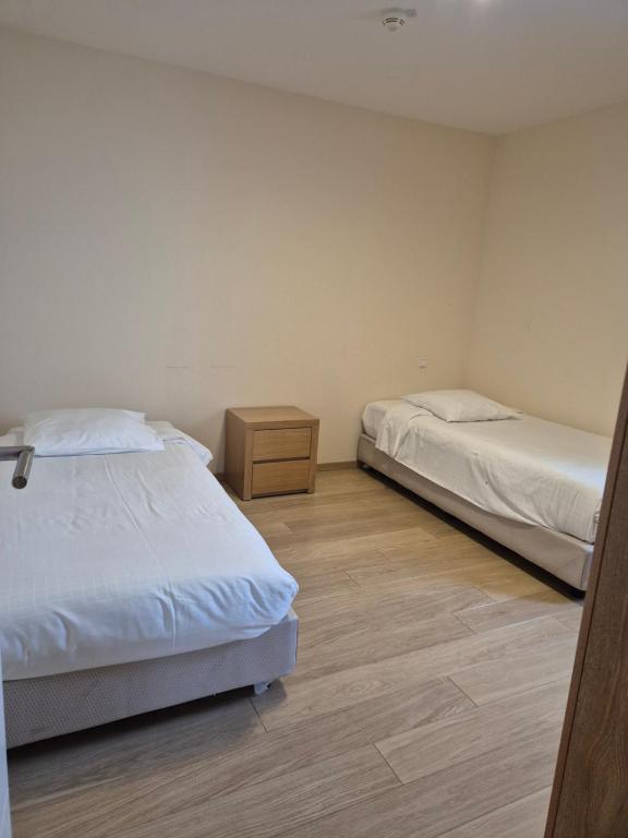 Postel nebo postele na pokoji v ubytování Hotel Bon Repos
