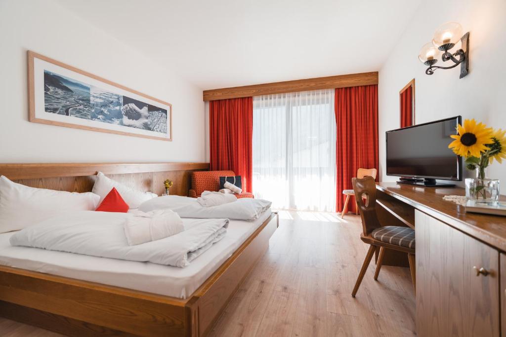 TV a/nebo společenská místnost v ubytování Smart Hotel Firn