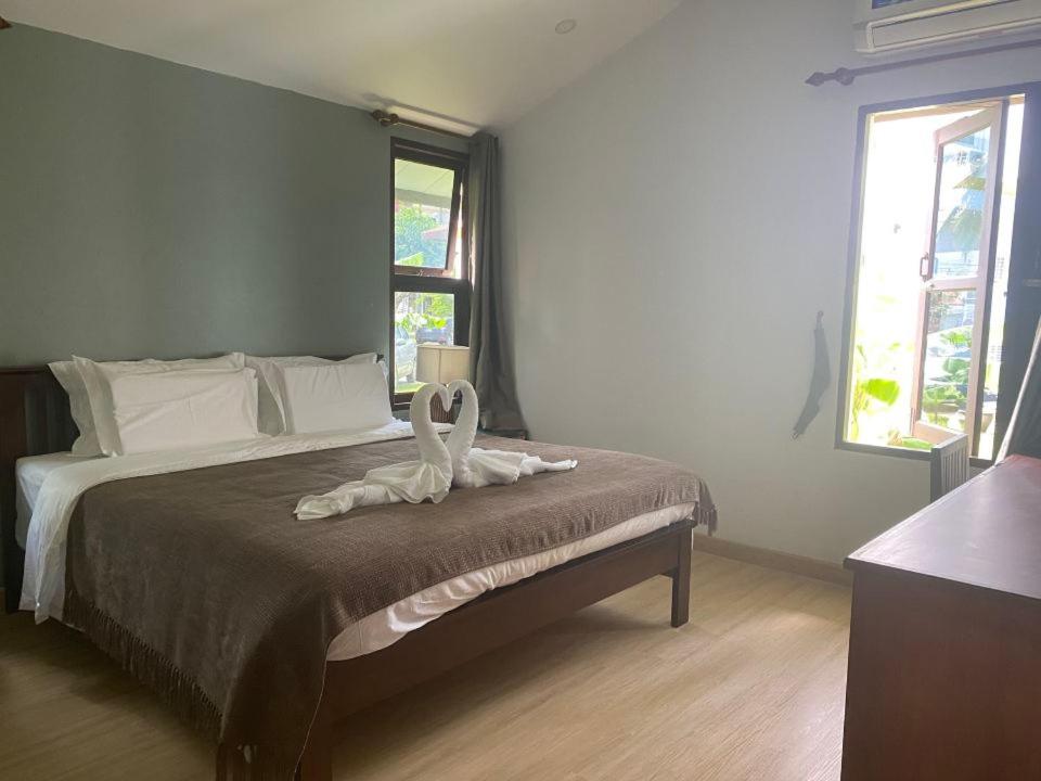 Postel nebo postele na pokoji v ubytování begonia N7 villa resort海棠7号别墅酒店