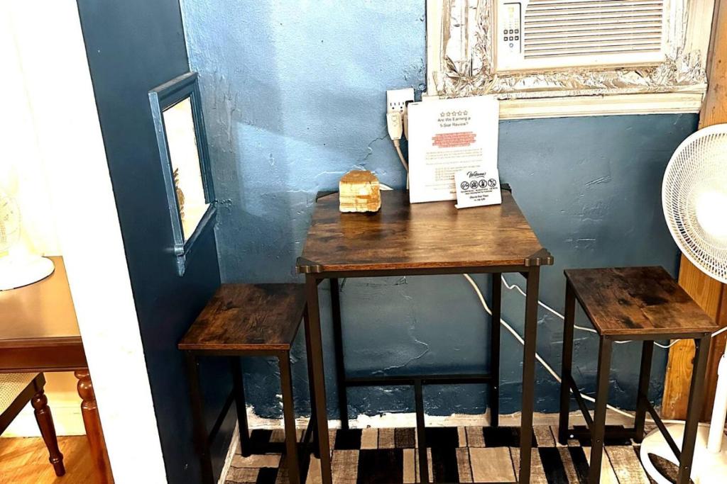 a table with a box on it next to a window at Economy 3 beds in Moorhead