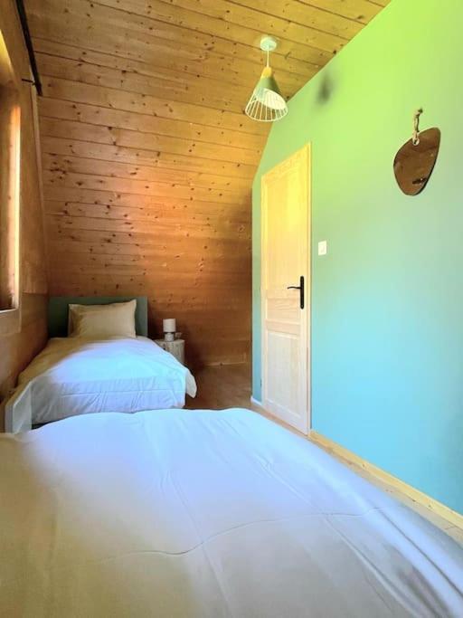 Postel nebo postele na pokoji v ubytování Domaine la Clairière