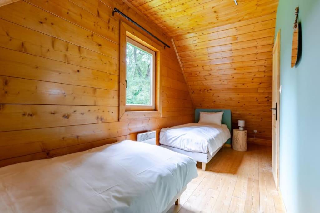 Postel nebo postele na pokoji v ubytování Domaine la Clairière