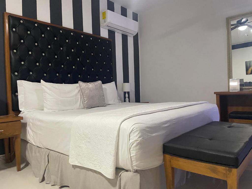 Postel nebo postele na pokoji v ubytování Gaia Residence Deluxe