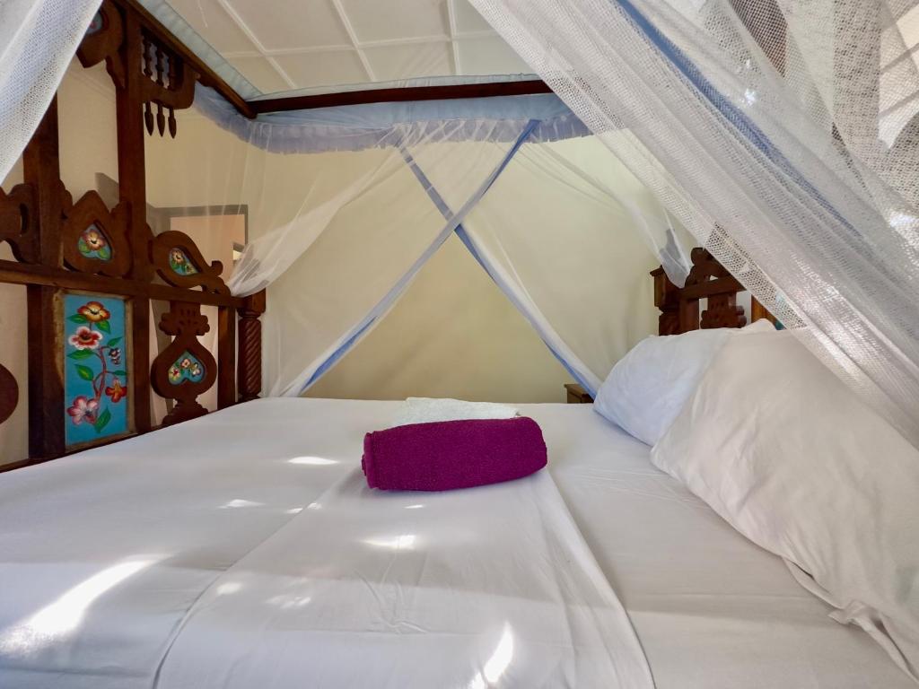 Postel nebo postele na pokoji v ubytování Banana Villas
