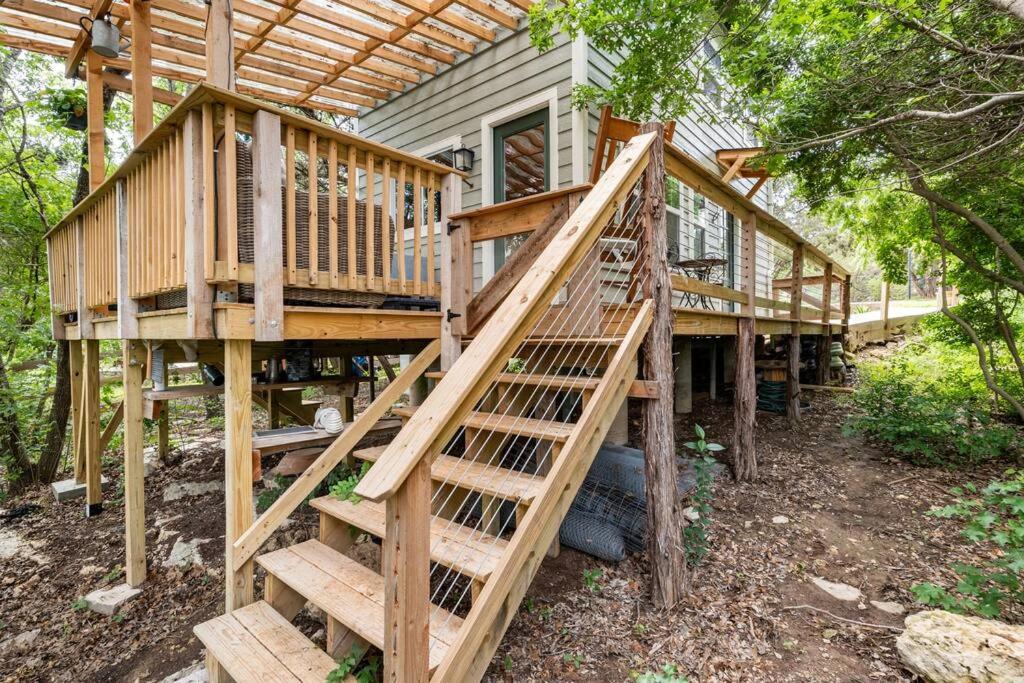 a wooden staircase leading up to a house at Cozy Coop Casita - Lake Travis-Hot Tub-Tiny House in Austin