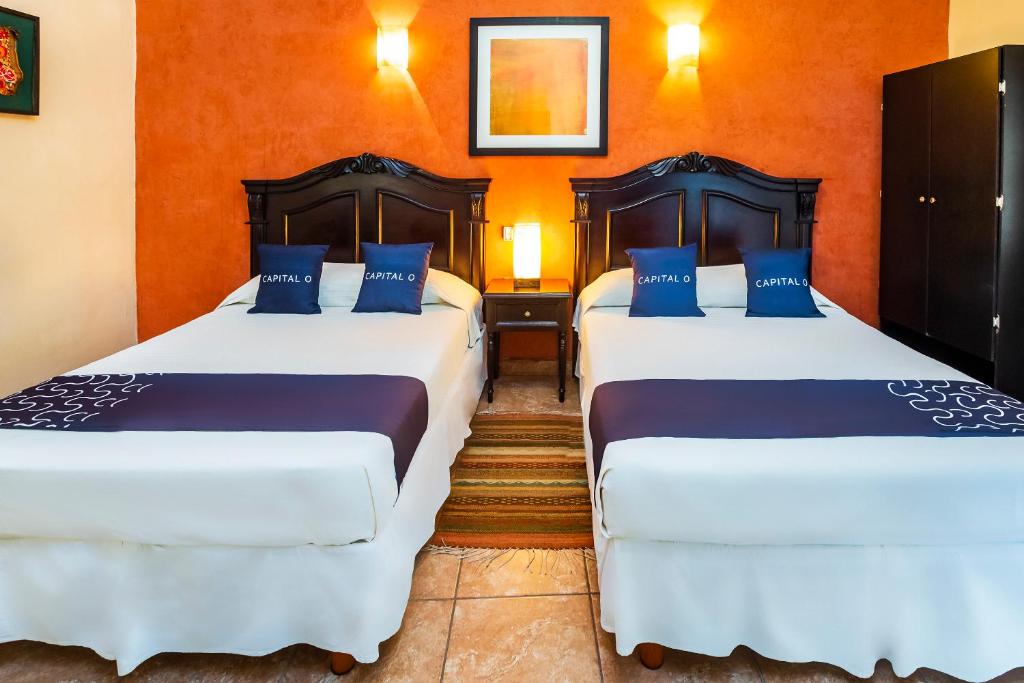 Postel nebo postele na pokoji v ubytování Hotel El Patio