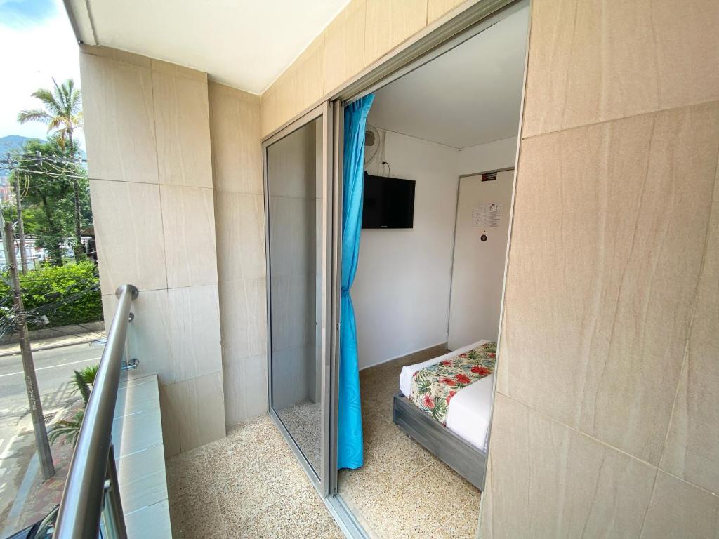 Postel nebo postele na pokoji v ubytování Hotel Plaza Mayor Itagui