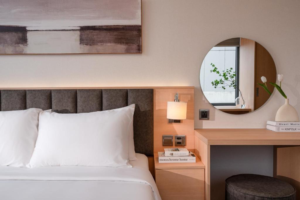 Voodi või voodid majutusasutuse Keypad Hotel - Linh Lang toas