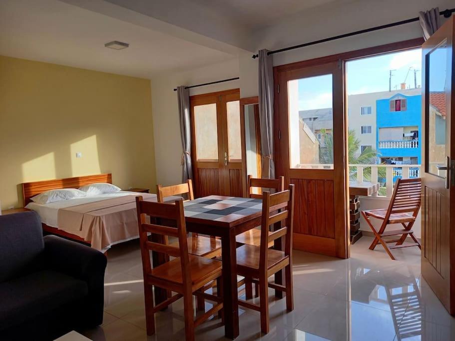 a room with a table and chairs and a bed at One cozy bedroom - Studio in Santa Maria in Santa Maria