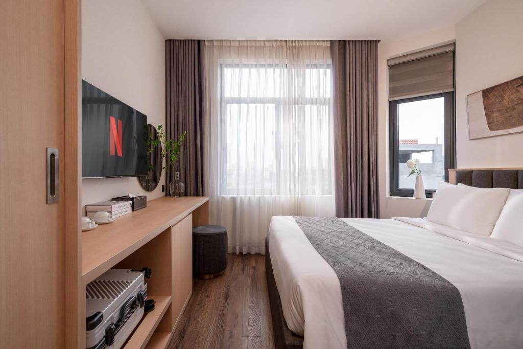 Voodi või voodid majutusasutuse Keypad Hotel - Linh Lang toas