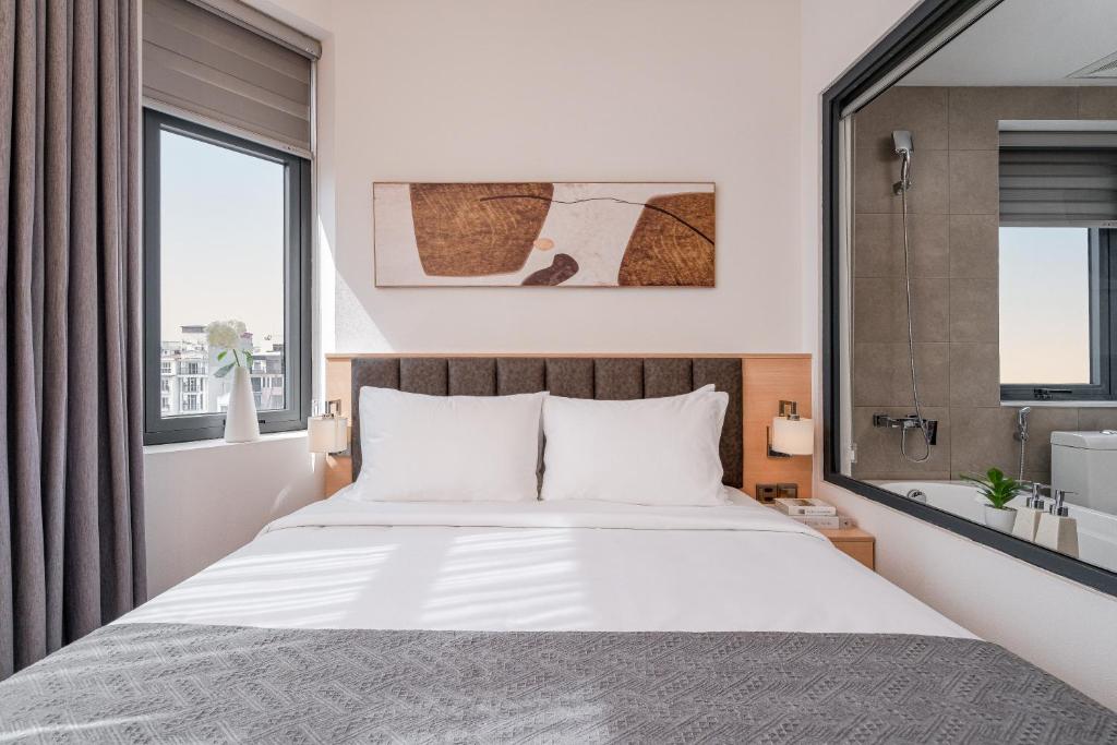 Voodi või voodid majutusasutuse Keypad Hotel - Linh Lang toas