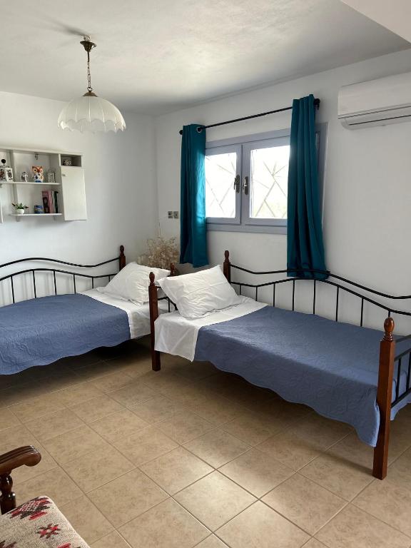 Posteľ alebo postele v izbe v ubytovaní Ada's House