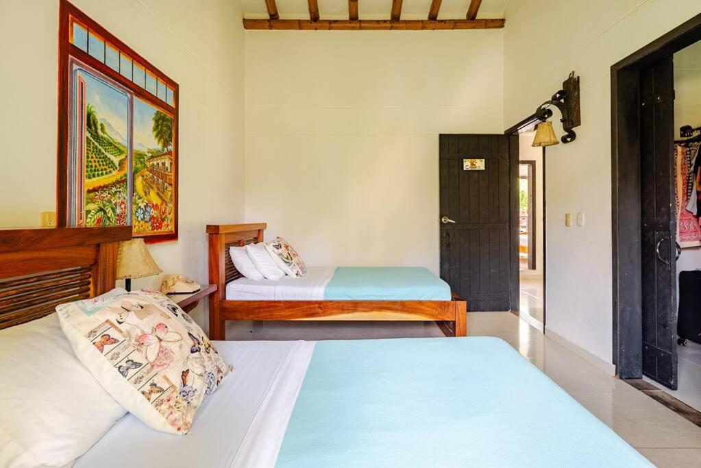 Una cama o camas en una habitación de Finca Panaca Herrería 8
