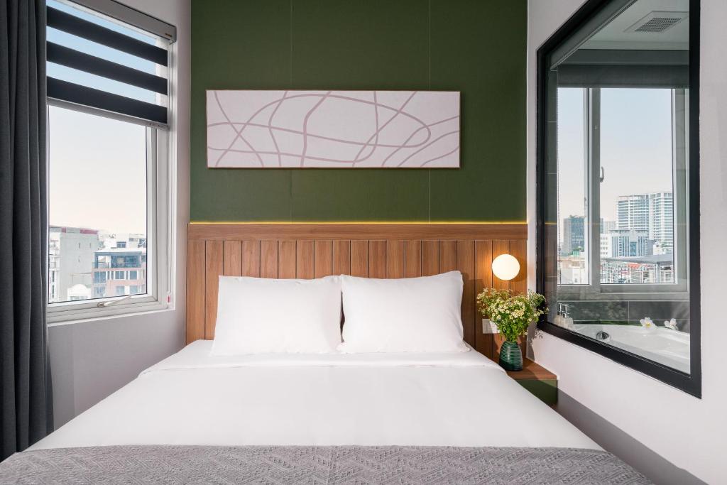 Voodi või voodid majutusasutuse Keypad Hotel - Linh Lang toas
