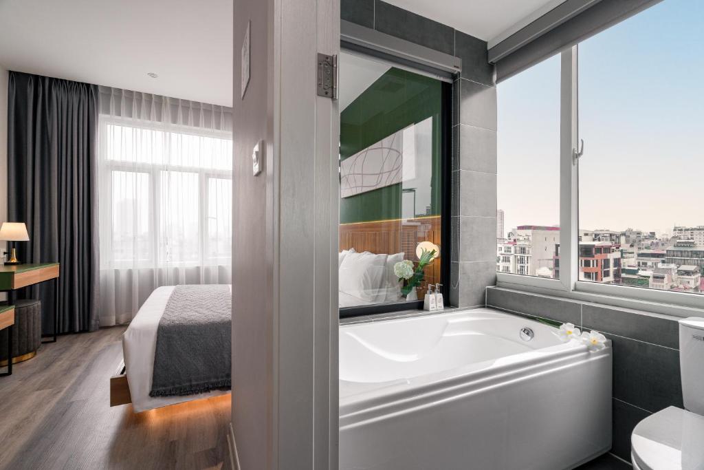 Voodi või voodid majutusasutuse Keypad Hotel - Linh Lang toas