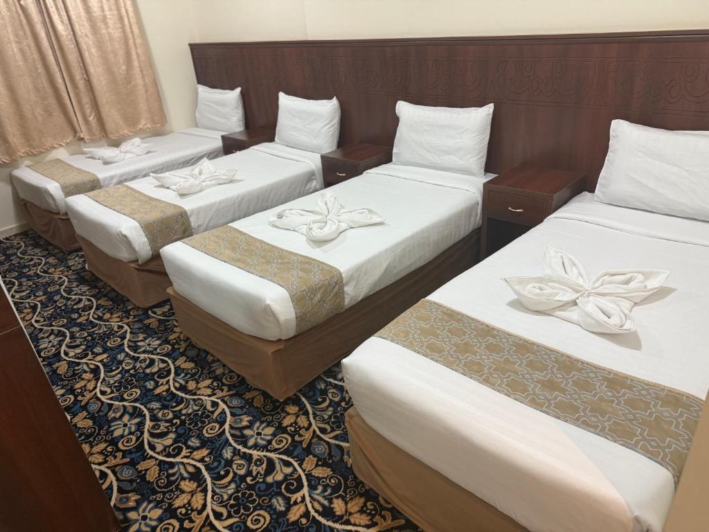 Postel nebo postele na pokoji v ubytování فندق غالب المشاعر