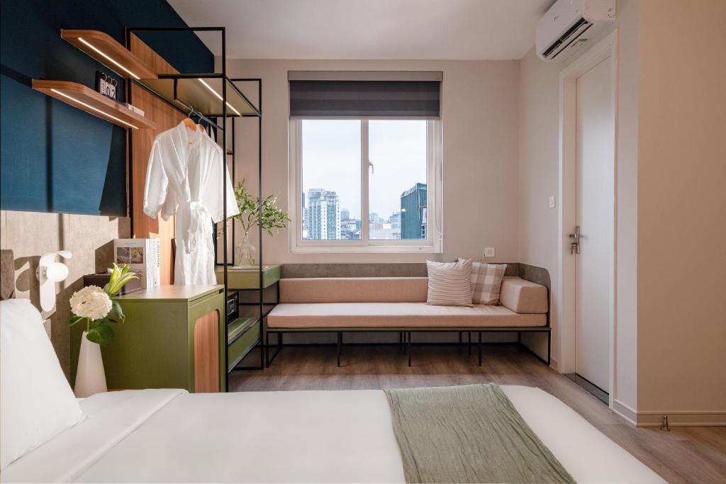 Voodi või voodid majutusasutuse Keypad Hotel - Linh Lang toas