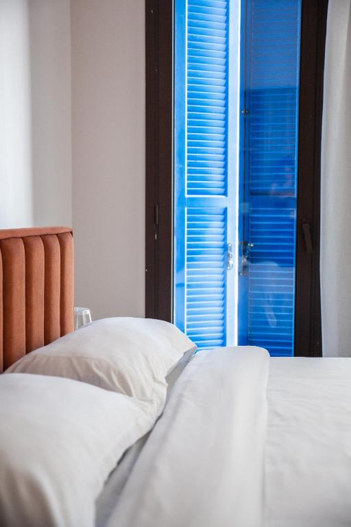 Postel nebo postele na pokoji v ubytování LIV & CO Suites & Villas