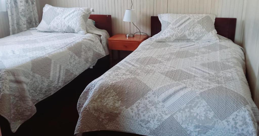 Postel nebo postele na pokoji v ubytování Cabaña Los Alpes