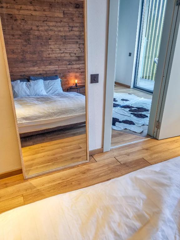 Postel nebo postele na pokoji v ubytování Atrium New Gudauri by Gudauri Travel