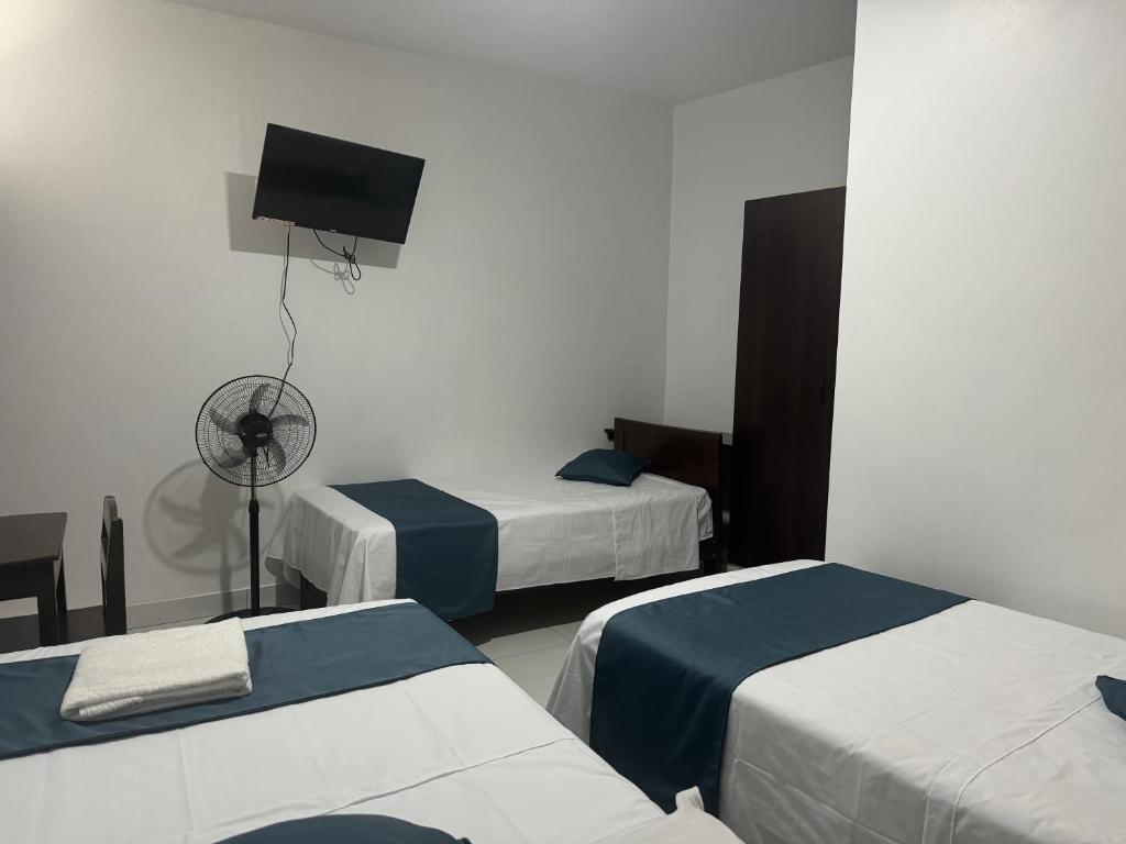 Postel nebo postele na pokoji v ubytování Hospedaje Marbis