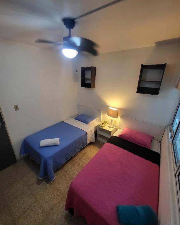 Voodi või voodid majutusasutuse Habitaciones R-6 toas