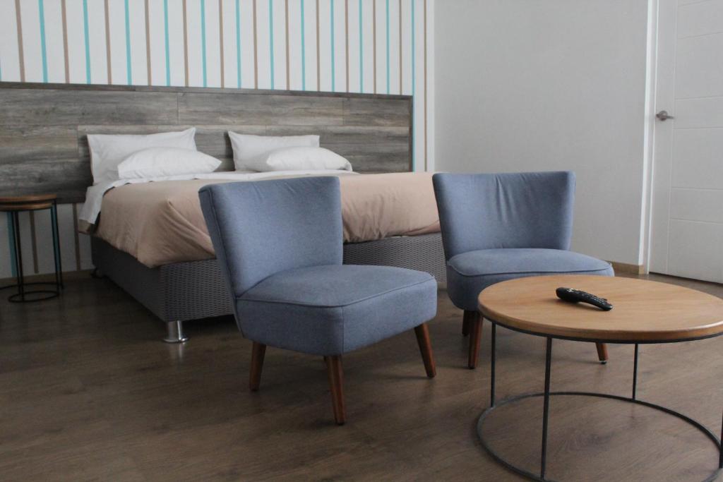 Postel nebo postele na pokoji v ubytování Basadre Apart Hotel
