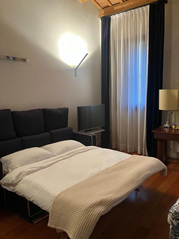 Postel nebo postele na pokoji v ubytování Ciao Amore