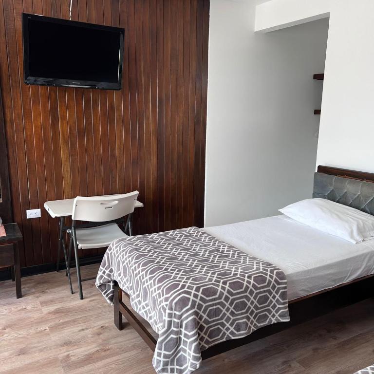Postel nebo postele na pokoji v ubytování Hotel Naralit