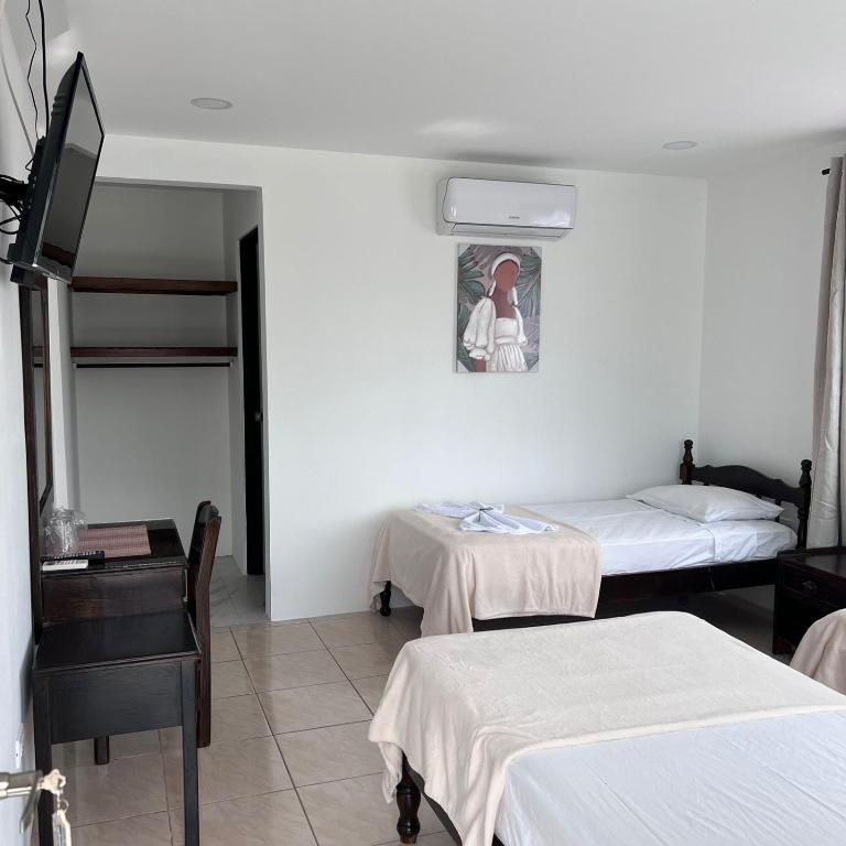 Postel nebo postele na pokoji v ubytování Hotel Naralit