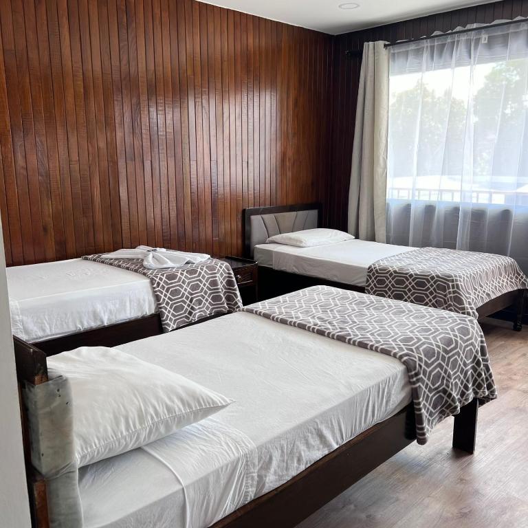 Postel nebo postele na pokoji v ubytování Hotel Naralit