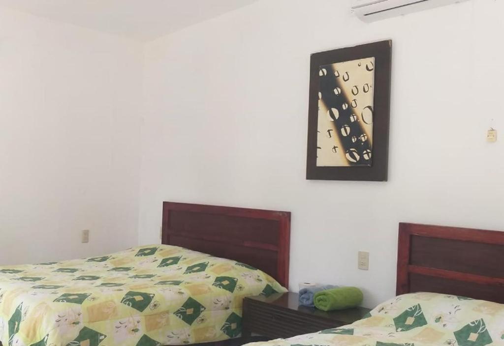 Postel nebo postele na pokoji v ubytování Hotel Mariam