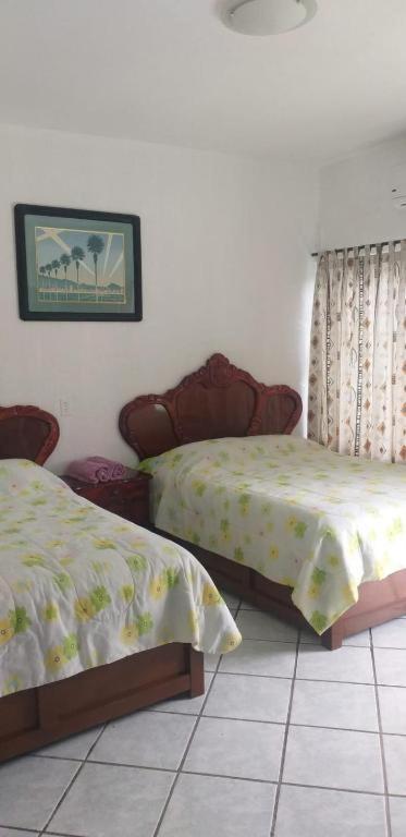 Postel nebo postele na pokoji v ubytování Hotel Mariam