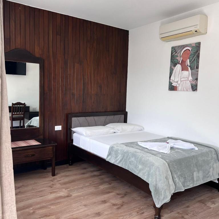 Postel nebo postele na pokoji v ubytování Hotel Naralit