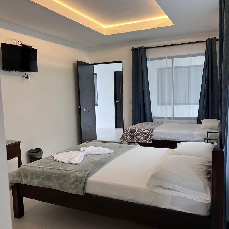 Postel nebo postele na pokoji v ubytování Hotel Naralit