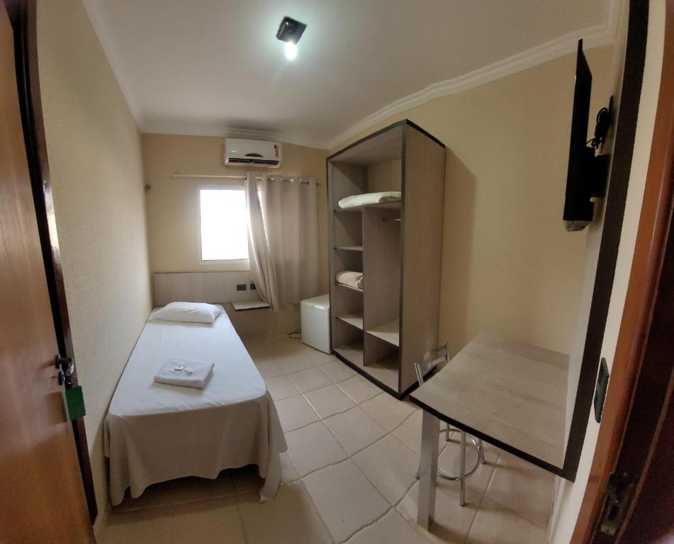 Postel nebo postele na pokoji v ubytování Hotel Globo