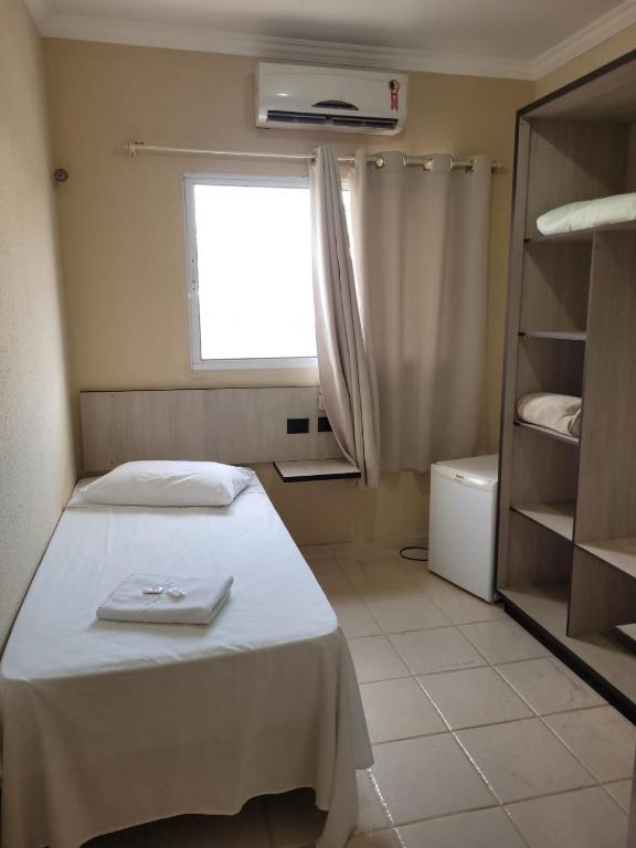 Postel nebo postele na pokoji v ubytování Hotel Globo