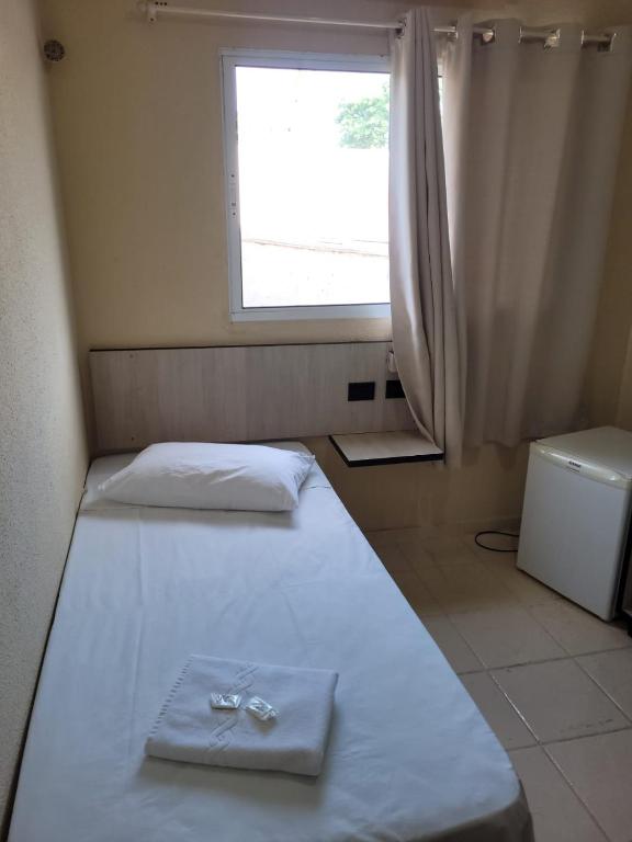 Postel nebo postele na pokoji v ubytování Hotel Globo