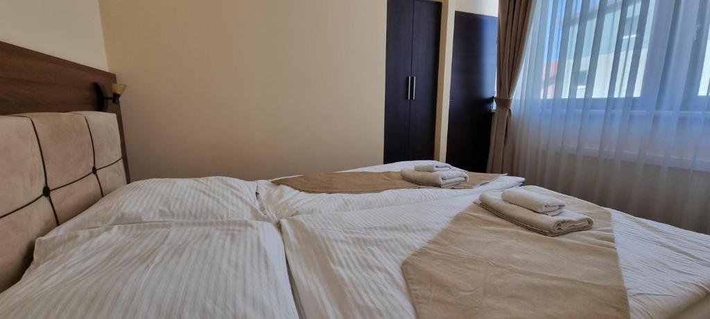 Postel nebo postele na pokoji v ubytování Elite Pension
