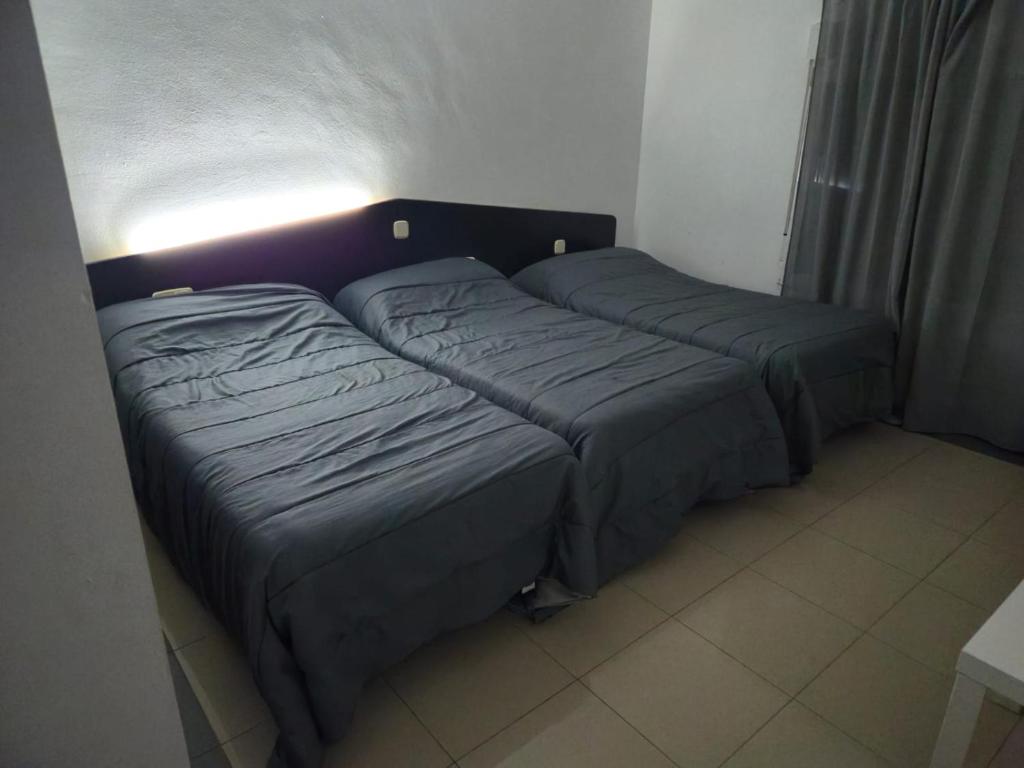 Postel nebo postele na pokoji v ubytování Hotel de castrillo LISBOA