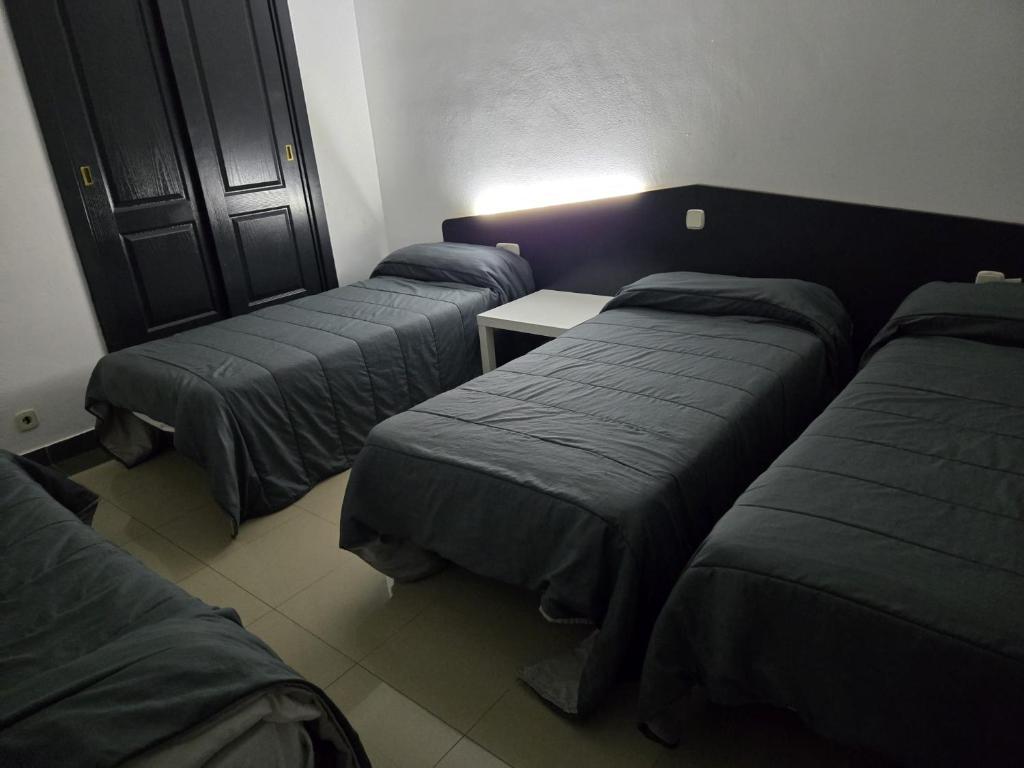 Postel nebo postele na pokoji v ubytování Hotel de castrillo LISBOA