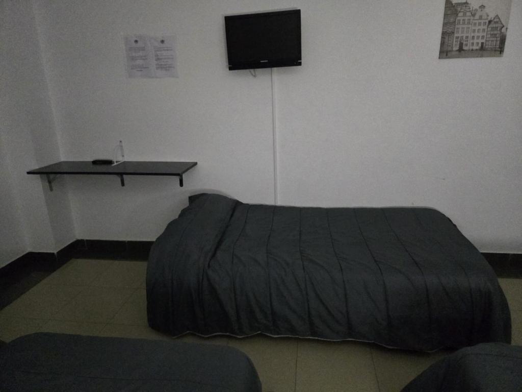Postel nebo postele na pokoji v ubytování Hotel de castrillo LISBOA