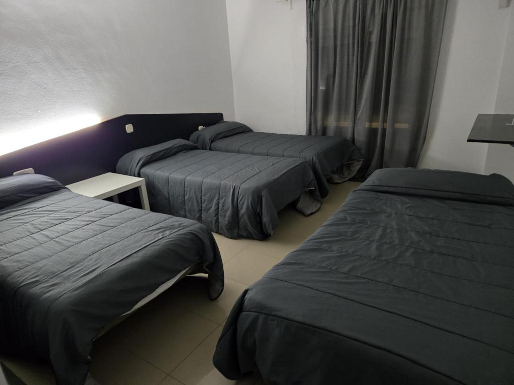 Postel nebo postele na pokoji v ubytování Hotel de castrillo LISBOA