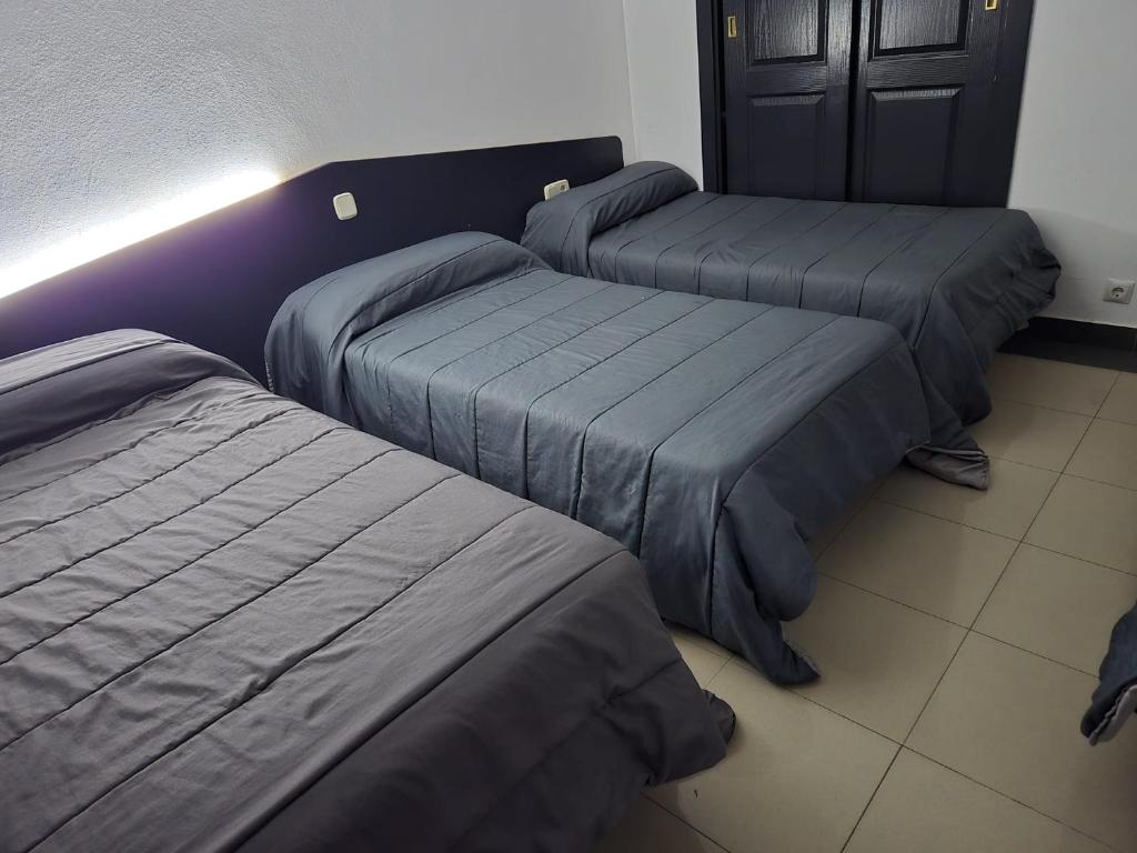 Postel nebo postele na pokoji v ubytování Hotel de castrillo LISBOA