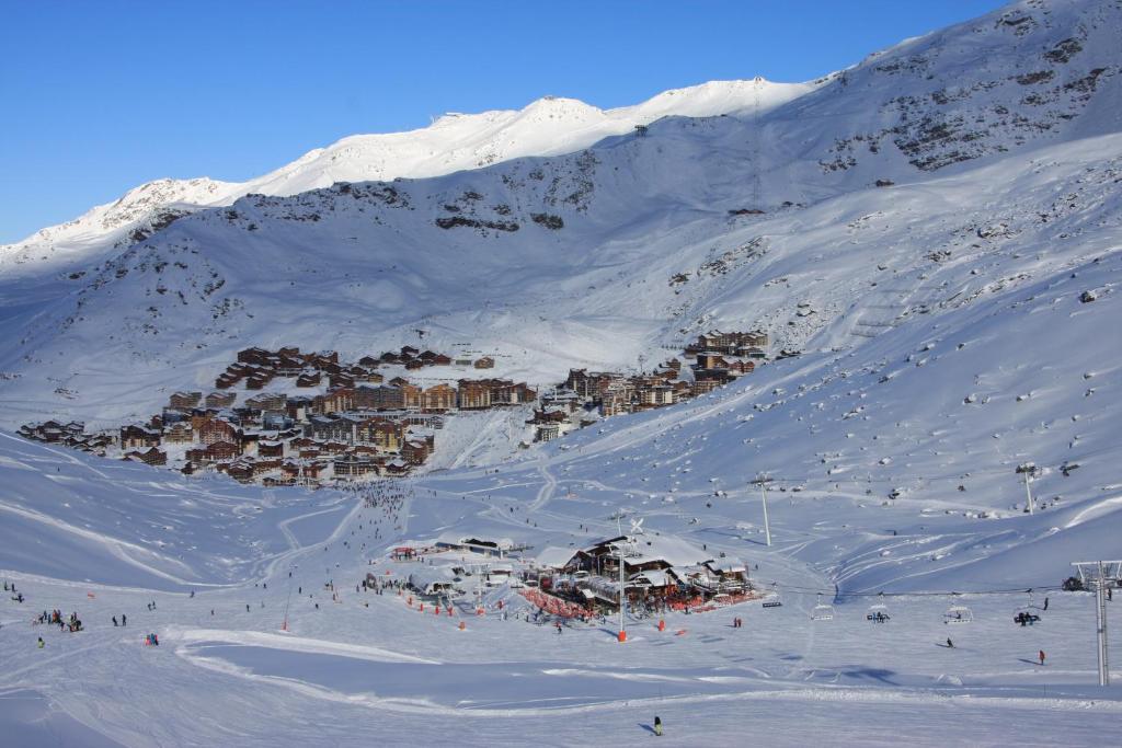 a ski resort on a snowy mountain in the snow at Les Chalets du Thorens in Val Thorens