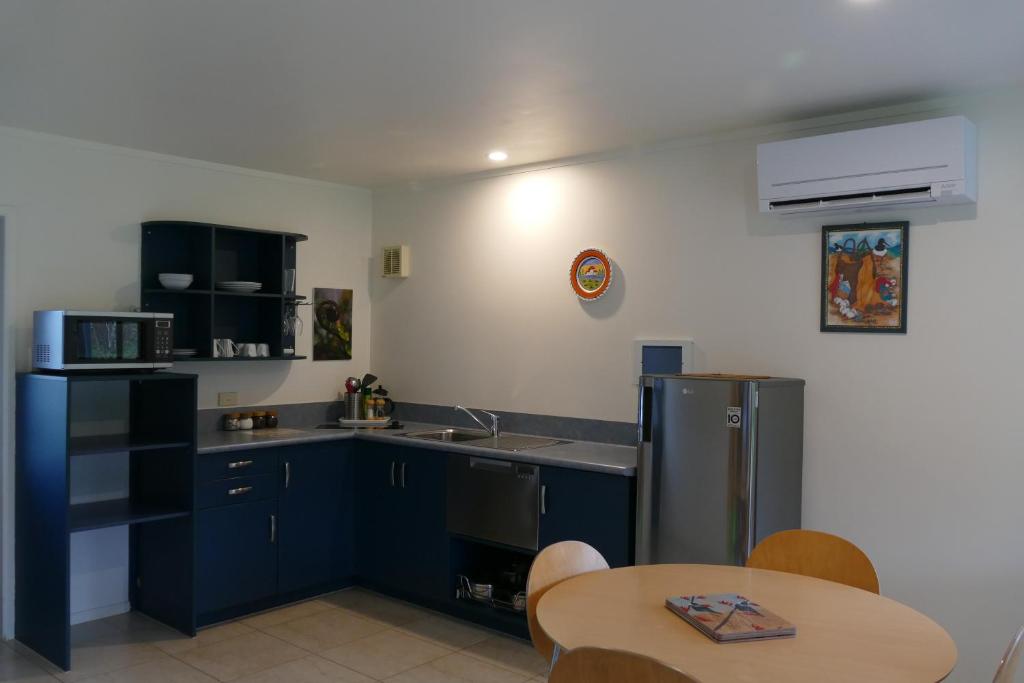 Kuchyň nebo kuchyňský kout v ubytování Patons Rock Beach Villas
