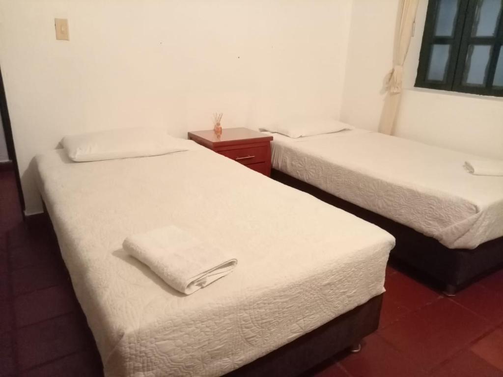 Postel nebo postele na pokoji v ubytování Hostal casa de los sueños