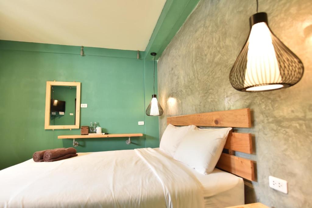 Postel nebo postele na pokoji v ubytování Rest Time Hotel