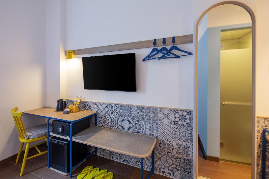 TV a/nebo společenská místnost v ubytování Kampi Hotel Legian