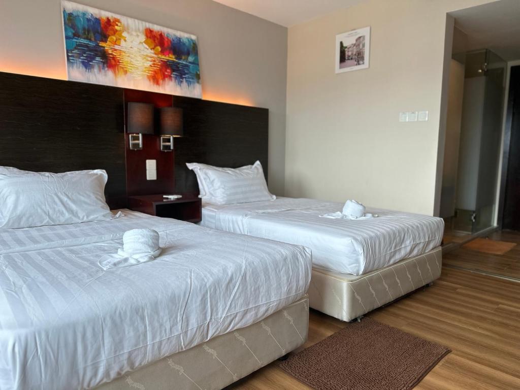 Letto o letti in una camera di Ming Greenage Suite 明绿时代套房 @Kota Kinabalu 亚庇市中心